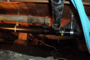 A clogged drain that is causing a plumbing leak.