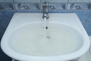 Sink filling up with water due to clogged drain.