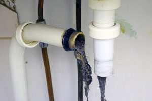 Open pipe showing clogging from hair and debris.